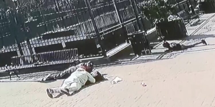 Exclusive Post footage shows the victims on the ground, as well as another man who went down for cover.