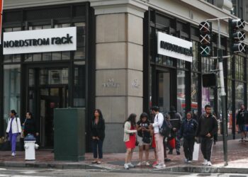 Pedestrians cross 5th Street at Market Street next to the Nordstrom Rack on Tuesday, May 2, 2023 in San Francisco, Calif