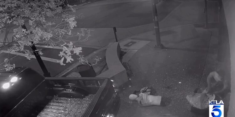 Security video image of truck plowing into store