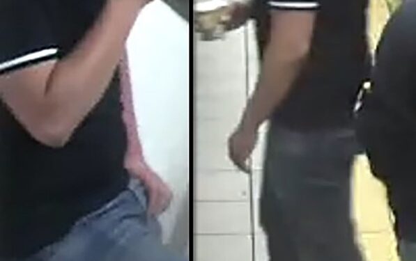 The suspect appears to be holding a coffee on the subway platform.