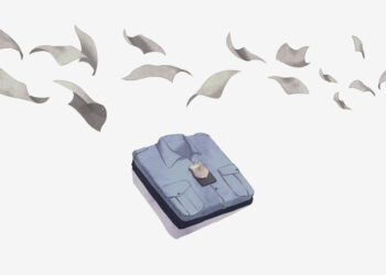 An illustration shows a correctional officer's light blue shirt and dark blue pants neatly folded in a pile. Loose sheets of paper fly above the shirt.