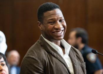 Majors smiles while in court