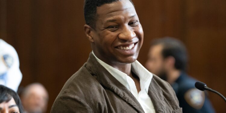 Majors smiles while in court