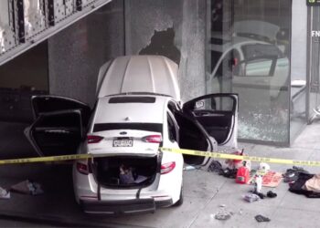 pictured is the scene on West 15th Street near 10th Avenue, where Bitton allegedly crashed into a building.