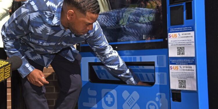 NYC Health Commissioner Ashwin Vasan introduced a pilot program to place vending machines containing harm reduction materials at the corner of Decatur Street and Broadway in Bushwick earlier today.  Naloxone (for heroin drug overdoses) is one of the products that people can get, as well as nicotine gum and condoms.  The machine will be maintained by a non profit called Services for the Underserved.