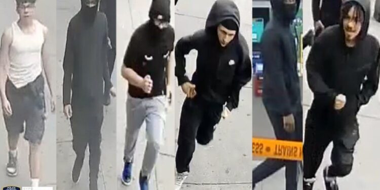 The robbery crew, most of them wearing hoodies, are seen running off.