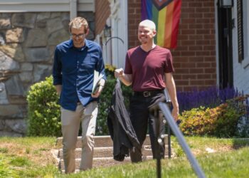 Samuel Brinton, 34, right, and his husband, Kevin Rieck, photographed outside their home in Rockville, Maryland on Friday, June 2, 2023.