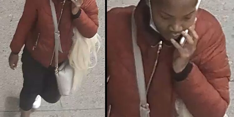 The suspect in the stabbing at Tillary and Jay streets is shown walking on the sidewalk while on the phone.