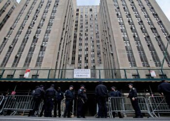 New York police officers provide security outside the Manhattan District Attorney's office in New York City on April 3, 2023.