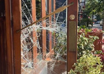 A smashed door at Balvanera after a burglary.