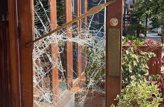 A smashed door at Balvanera after a burglary.