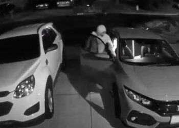 One man's girlfriend's car was broken into after he saw about 10 people walking down the street late at night.