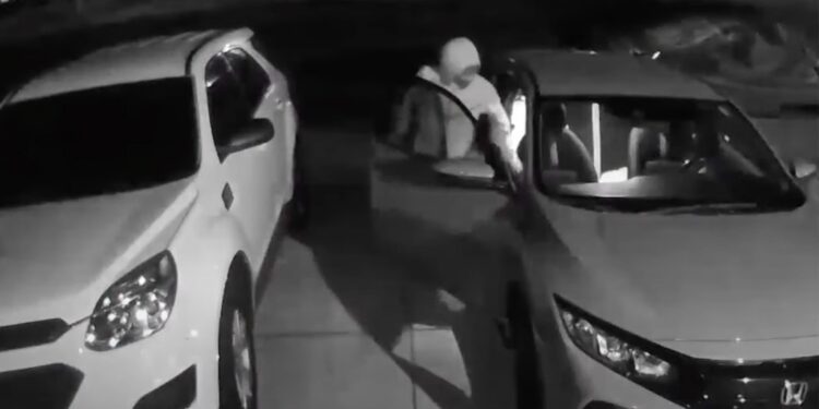 One man's girlfriend's car was broken into after he saw about 10 people walking down the street late at night.