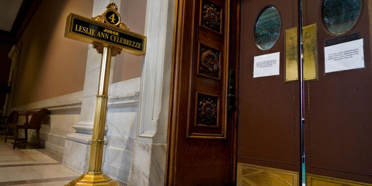 A black and gold plaque reads: “Judge Leslie Ann Celebrezze.”