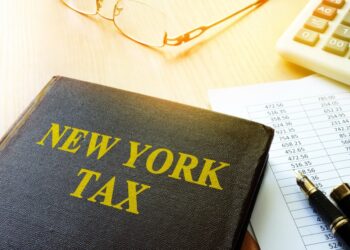 Book with title New York tax and calculator.