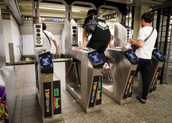A general view of a person jumping a subway turnstile in New York, NY on July 15, 2023.
