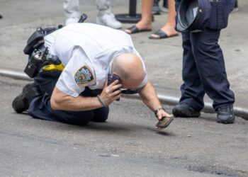 NYPD look for shell casings at the scene
