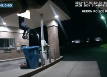 Officers arrived just in time to hear unusual sounds coming from above the bank's drive-thru and witness the access door loudly swing open.