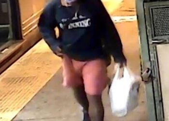 The Newkirk Plaza assault suspect is seen walking on the platform.