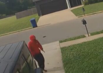 The unidentified 15-year-old walking up the driveway after being thrown from the car.