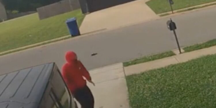 The unidentified 15-year-old walking up the driveway after being thrown from the car.