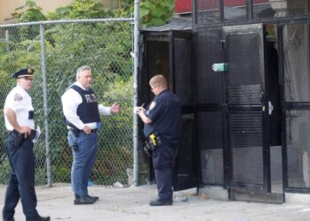 Police investigate the scene of a shooting in the Bronx Monday morning.
