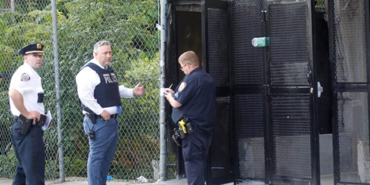 Police investigate the scene of a shooting in the Bronx Monday morning.