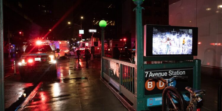 Emergency vehicles are seen at the 7th Ave. and 53 St. subway station.