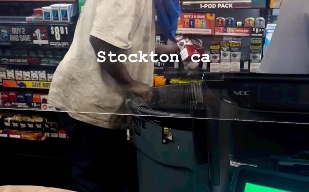 The man loads his garbage bin.