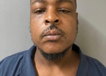Reggie Ray turned himself in to the police after using a chair to whack at least two white boaters.