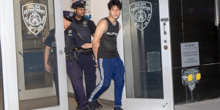 Kyle Fernandez in handcuffs