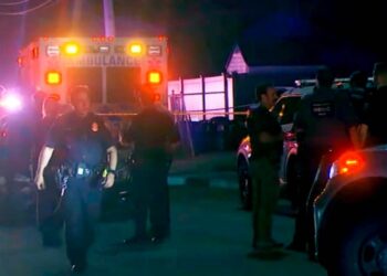 Police respond to the scene where at least four people were shot, one fatally, outside a rental hall at 85 Ocean Avenue in Valley Stream.