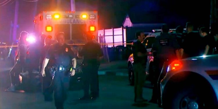 Police respond to the scene where at least four people were shot, one fatally, outside a rental hall at 85 Ocean Avenue in Valley Stream.