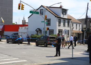 Police at the scene of where an off-duty NYPD cop was shot in Queens on August 30, 2023.