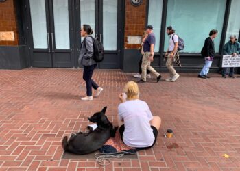 A homeless lady is shown begging on Market Street of San Francisco, California on Thursday, August 17, 2023. The Mayors office has faced a lot of criticism related to crime and homeless issues in the city.