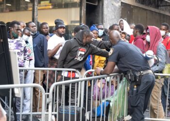 Crowds of migrants flood NYC looking for asylum.