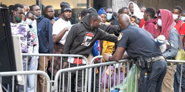 Crowds of migrants flood NYC looking for asylum.