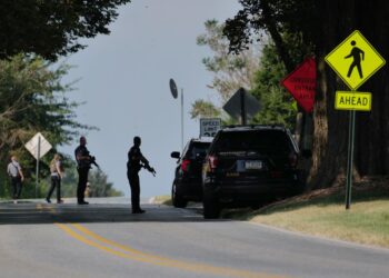 Police stand guard on the perimeter of a search zone for an escaped prisoner on September 08, 2023 in Kennett Square, Pennsylvania.