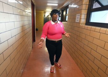 Shaquana Applewhite stands exasperated in her hallway in the Bushwick Houses.