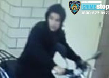 The suspect in the series of stick-ups is shown wearing a black hoodie and riding a scooter.
