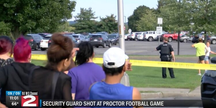 People look at a police investigation from behind crime tape.