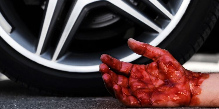 A 46-year-old man was charged with murder Tuesday for allegedly running over a man with his car on a sidewalk more than a decade ago after a spat in Brooklyn, police said