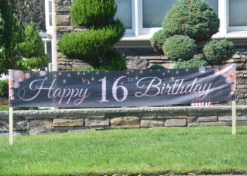 A "Happy 16th Birthday" banner was on display in the shooting victim's yard on Pompey Avenue near Wilson Avenue in Eltingville.