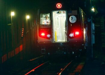 The N train seen in an NYC subway tunnel.