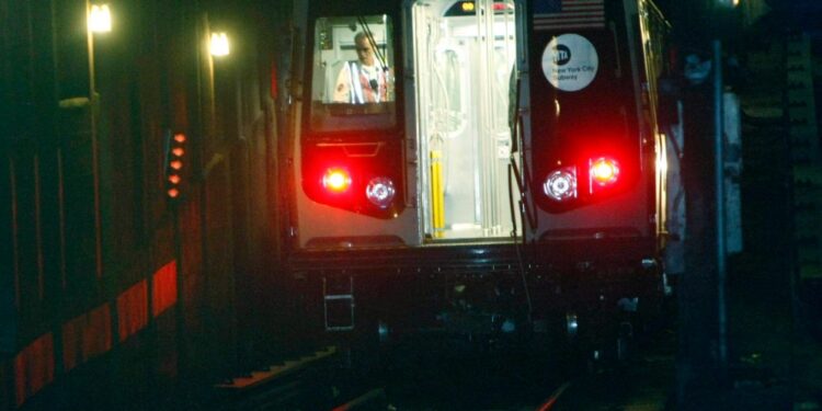 The N train seen in an NYC subway tunnel.
