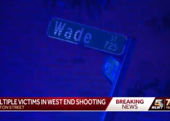 Screenshot of TV news report about Cincinnati shooting showing street signs of where it occurred near, Wade Street sign visible.