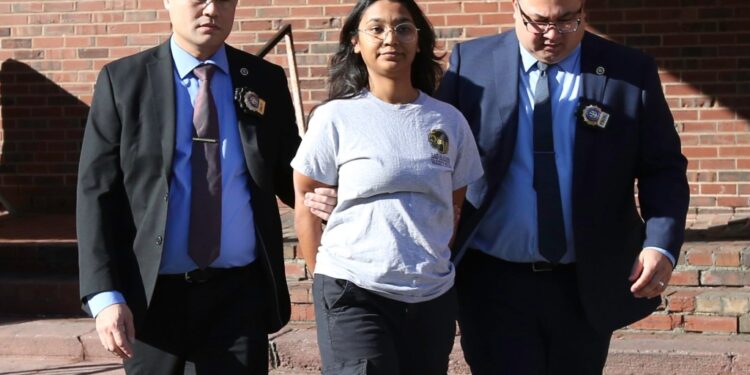Mehwish Omer is walked from the 7th Precinct/Hate Crimes Unit in Manhattan, NY on November 27, 2023 after being charged with assault 3 hate crime.