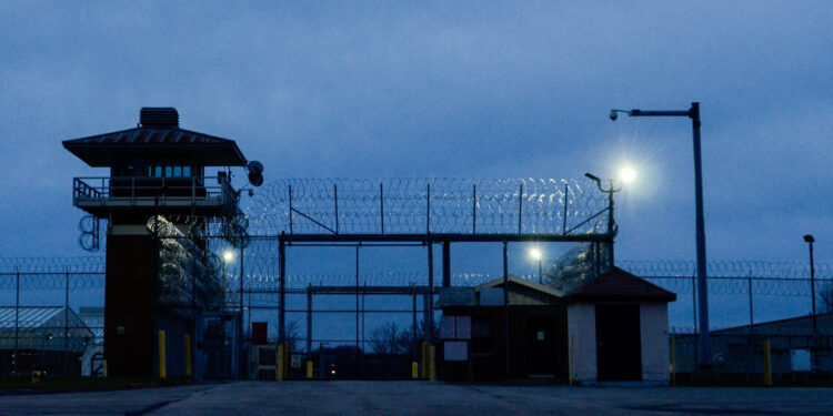 A view of the entrance gate of Attica Correctional Facility in New York, at dusk.