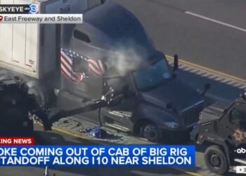 Police use a Rook to break down the door.