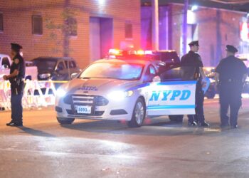 A general view of NYPD officers at a crime scene in the Bronx, NY on September 12, 2015.